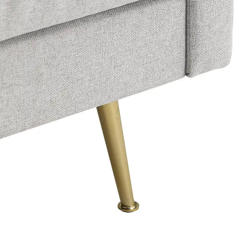 Divano in tessuto grigio con gambe in metallo dorato